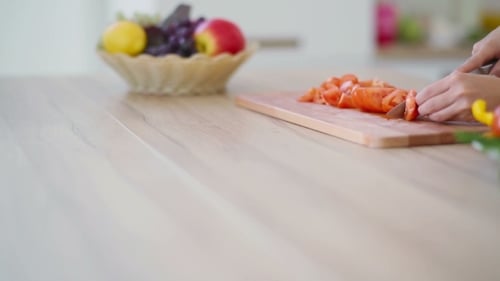 Woman Is Slicing Tomato