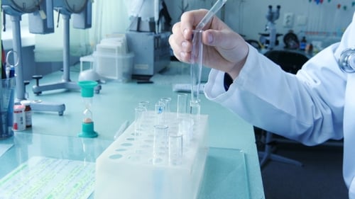 Scientist Fill a Test Tube Of Liquid