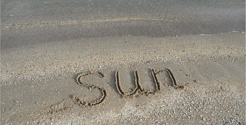 Gentle Waves on Sandy Beach With Summer Message