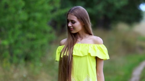 Young Woman Posing in a Dress Outdoors
