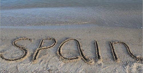 Word Spain Written in Beach Sand