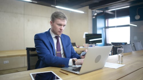 Businessman Using Credit Card for Online Payment