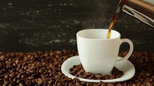 Fresh Hot Coffee Being Poured into a Mug