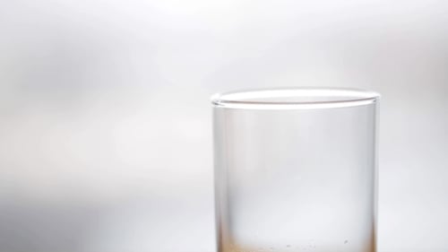 Water Being Poured Into A Glass