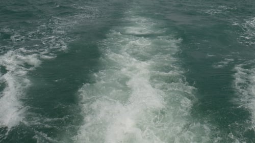 Sea Water Trails Behind Boat