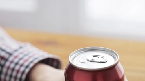 Opening a Refreshing Soda Can Close Up