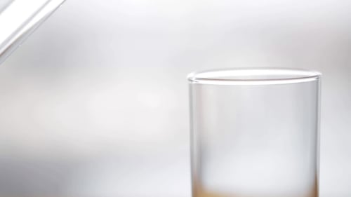 Water Being Poured into a Glass Cup