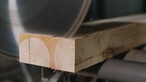 Circular Saw Cuts Through Wood Plank Close Up