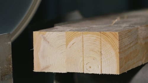Wood Being Cut By A Silver Blade