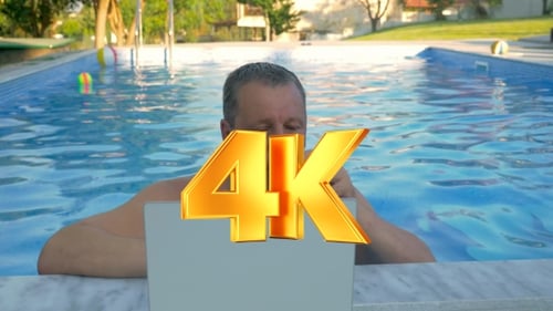 Smiling Man In Home Pool With Laptop
