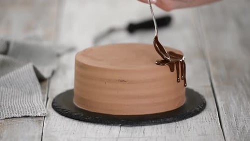 Chocolate Cake Gets Drizzled With Chocolate Frosting
