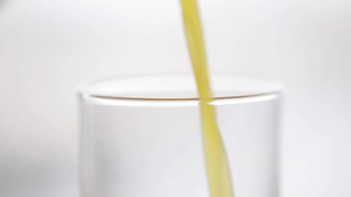 Juice Pouring Into Glass Close Up Shot