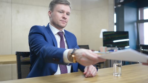 Businessman Giving Documents