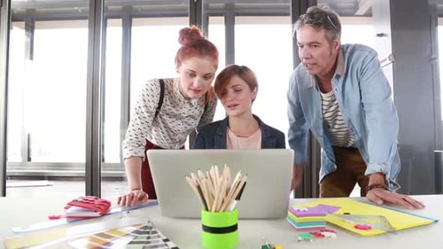 Team of Employees Collaborating in a Modern Office
