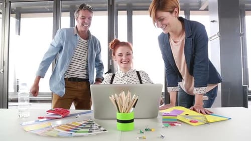 Team Celebrates Success in Bright Urban Office