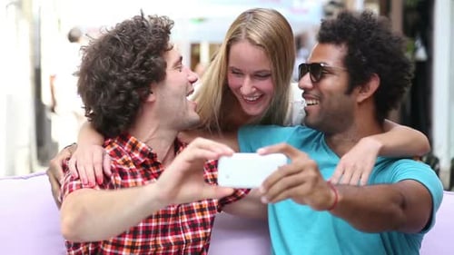 Friends Taking Selfie Together Outdoors in Urban Setting
