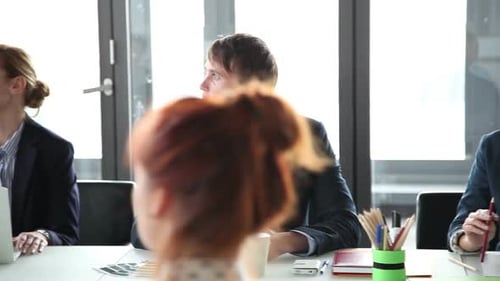 Business Meeting with Employees in an Urban Office