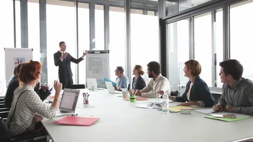 Business Presentation to Team in Modern Office