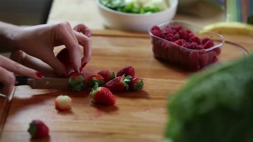 Close-Up Of Cutting Strawberries 1