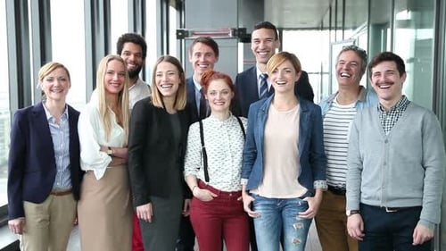 Smiling Team Posing in Modern Office Space