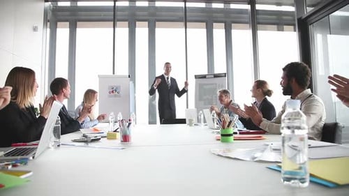 Colleagues Applauding Smiling Businessmen During A Meeting 2