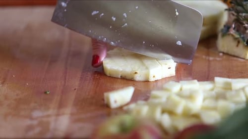 View Of Woman Hands Cutting Pineapple Into Pieces 3