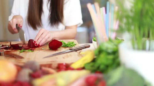 Woman Cutting Beetroot With Knife 2