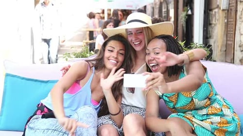 Beautiful Young Women Having Fun Taking Selfies In Town 6