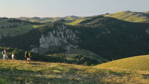 Family Hiking on Mountain Hillside Landscape