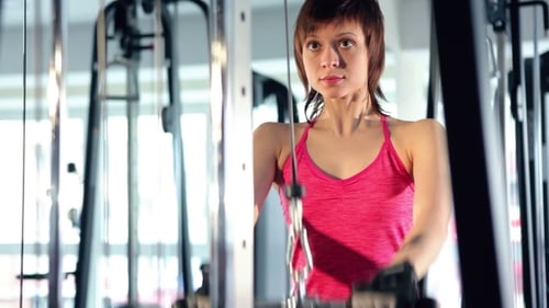 Woman Working Out At The Gym