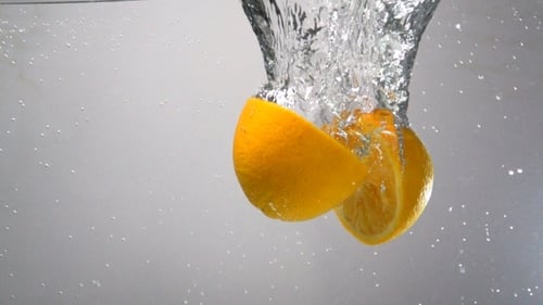 Parts Of Orange Drops Under Water