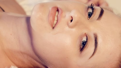Beautiful Blonde Woman Lying Down in Close Up