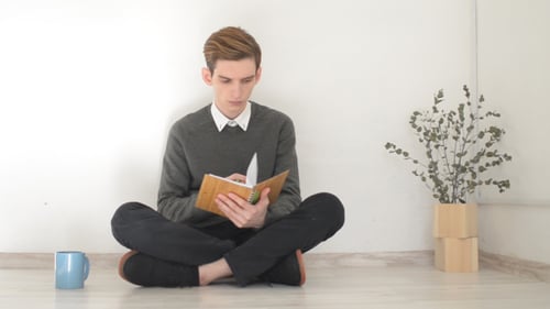 Reading and Writing, While Sitting on Floor in Room