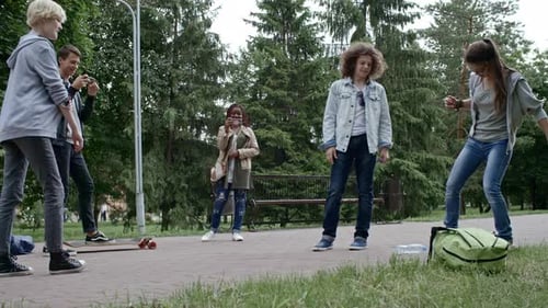 Teenagers Performing Water Bottle Flip