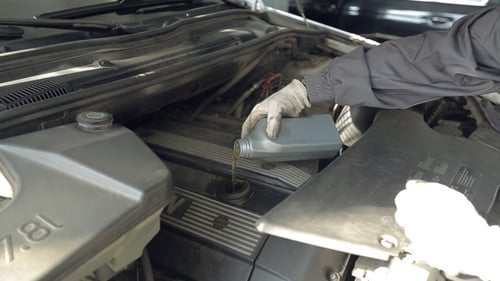 Adding Oil to Car Engine Under the Hood