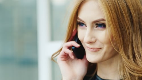 Beautiful Woman With Long Hair, Talking On The Phone Outdoors