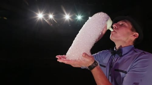 Man Creates Tower of Soap Bubbles on Stage