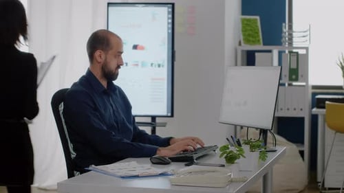 Businessman Typing on Keyboard for Corporate Work