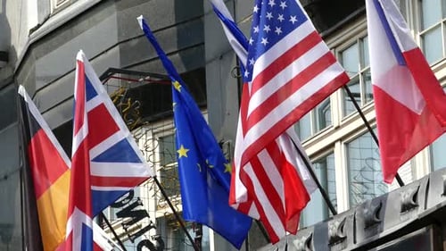 International Flags Waving on Building Exterior in Daytime