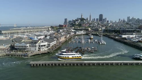 Aerial view of a ship sailing by Pier 39