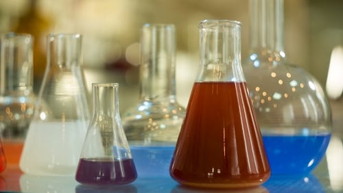 Colorful Liquids in Science Beakers and Flasks