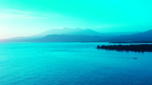 Aerial drone shot tourism of idyllic coastline beach holiday by shallow ocean with white sand backgr