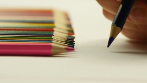 Female Hand Painting With Colored Pencils