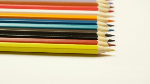 Colorful Pencils Arranged in a Precise Row