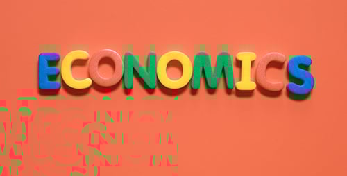 Hands Spell Economics with Colorful Foam Letters