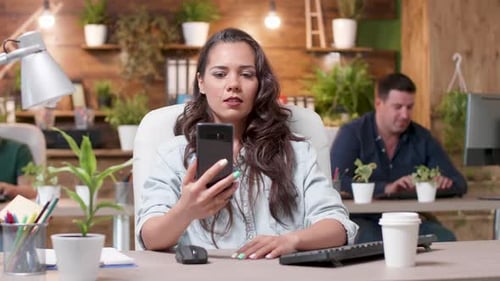 Woman on Video Call in Modern Office