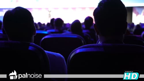 Audience watching a presentation at a corporate event