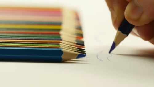 Hand Drawing With Blue Colored Pencil On Paper