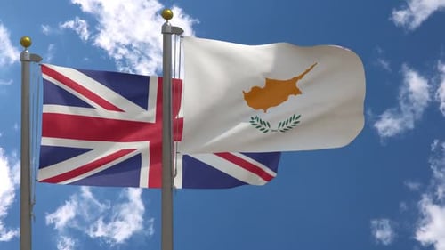 United Kingdom and Cyprus Flags Waving Together in Blue Sky