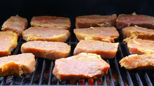 Juicy Steaks Sizzle On Flaming Smoking Grill
